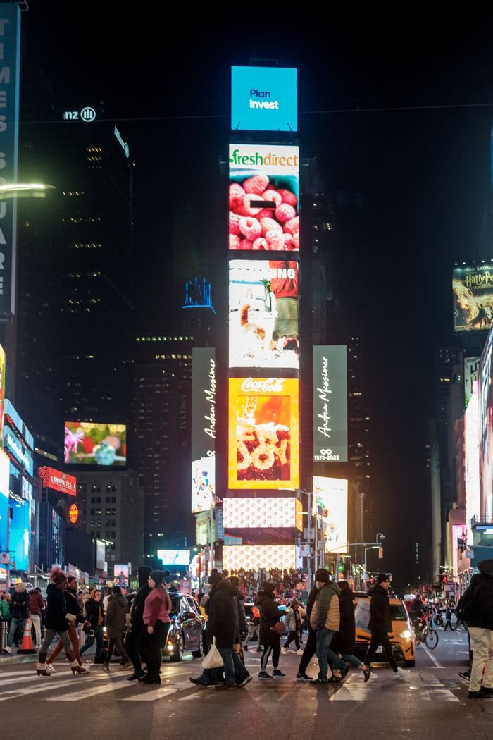 The Art of Drawing Readers In: Your attractive post title goes here Thriving nightlife at Times Square with bright lights and bustling crowds in New York City.