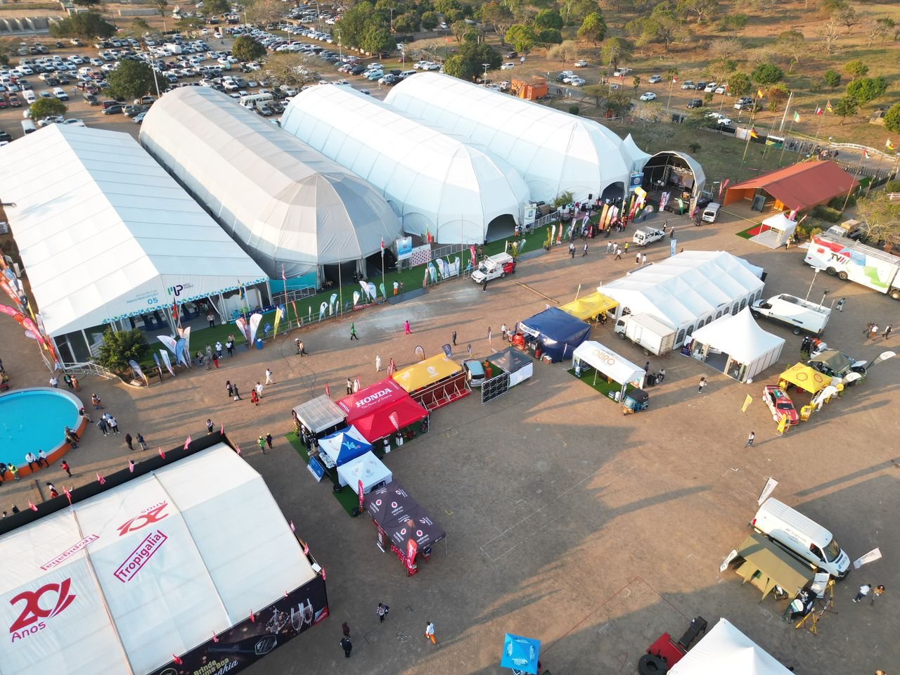 Our Services Aerial photo capturing an outdoor event with multiple tents in Maputo, Mozambique.